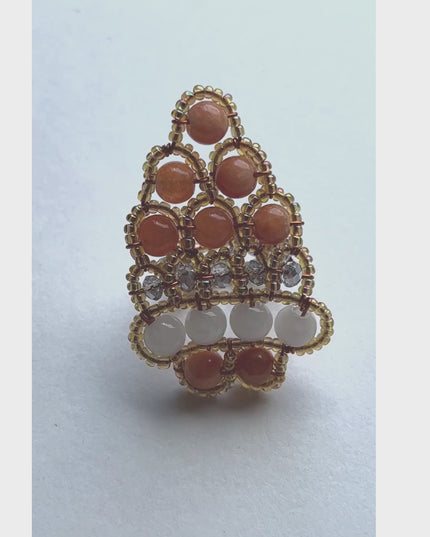 The handcrafted ring is made predominately of red coral beads in varying colors in an organic design which includes seed beads and crystal beads - Sundara Joon