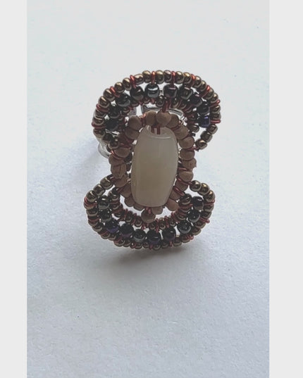 Gemstone surrounded by wood and seed beads in figure 8 pattern - Sundara Joon